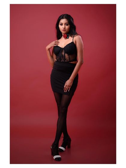 A full-length view of the outfit, showcasing the complete look in a powerful and confident stance.