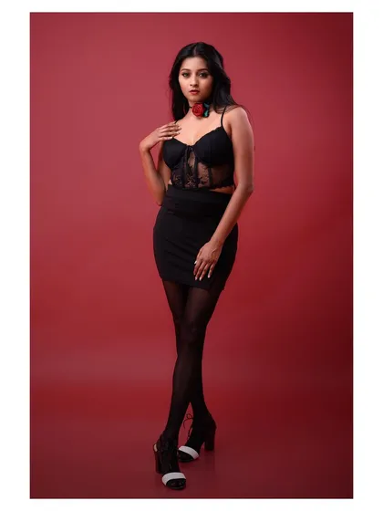A full-length view of the outfit, showcasing the complete look in a powerful and confident stance.