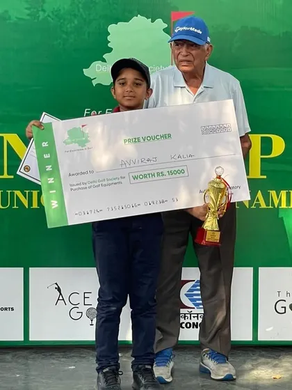 Avviraj Kalia with his winner's trophy and prize voucher at the NCR CUP.