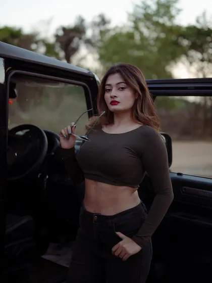A duplicate of image 420, this portrait with a Thar jeep adds a rugged and adventurous element to a fashion shoot.