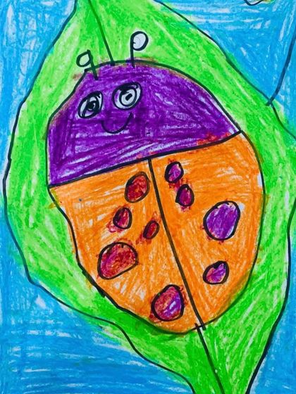 This smiling ladybug showcases the fun and creativity our preschoolers bring to their work. They learn fundamental drawing skills while expressing their unique personalities.