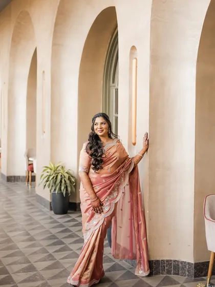 A solo portrait of the beautiful engagement bride. Her makeup features soft curls and a subtle glow that enhances her natural elegance, making for a timeless and classic photograph.