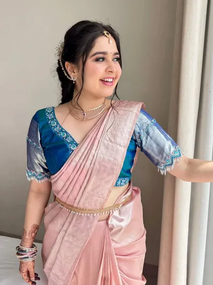 The complete look, with a beautifully draped silk saree and a soft, romantic hairstyle.