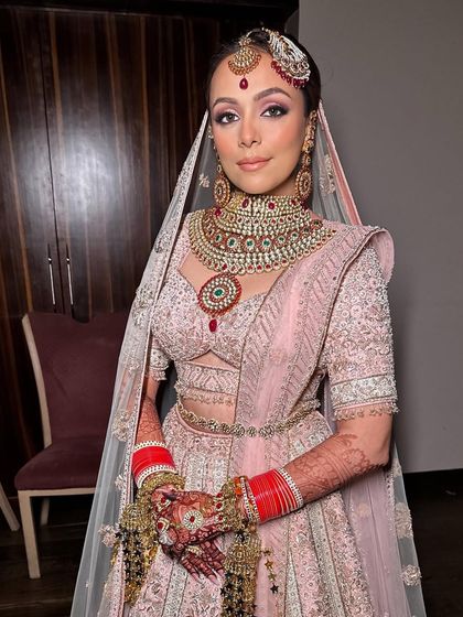A super dewy and soft bridal makeup look for my bride Ridhima. I accentuated her eyes and focused on creating a lit-from-within glow to complement her pastel pink lehenga.