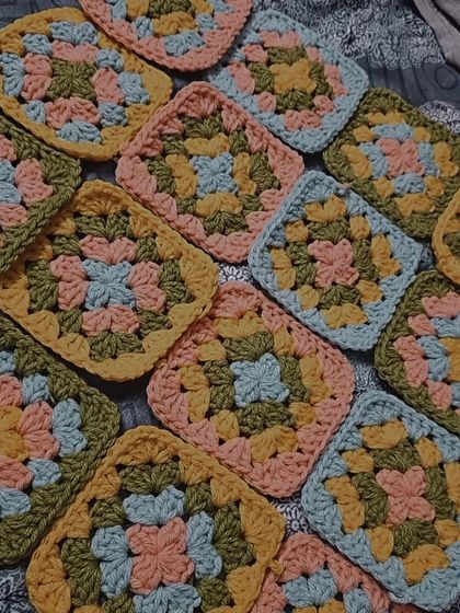 A satisfying shot of all the granny squares I made in one day. I officially completed 100 squares for a big project. It's a long process, but so rewarding.