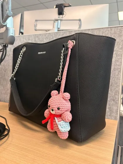 An aesthetic picture from a client showing my teddy bear charm looking stylish on her black tote bag. I love seeing my creations out in the world!