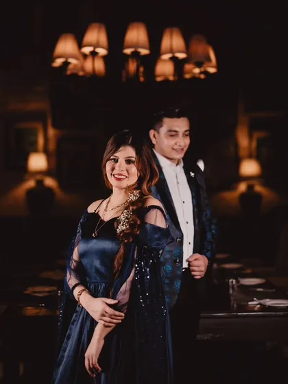 A lovely portrait of the couple. The bride is wearing the navy blue gown with its detachable trail and sequined sleeves, looking effortlessly chic.
