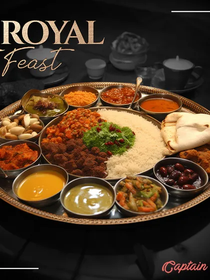 For those who desire a truly regal dining experience, I present the 'Royal Feast'. This traditional Indian thali is a masterpiece of culinary art, featuring a wide assortment of dishes that offer a journey through India's rich flavors. It’s a statement of elegance and abundance for your most special occasions.
