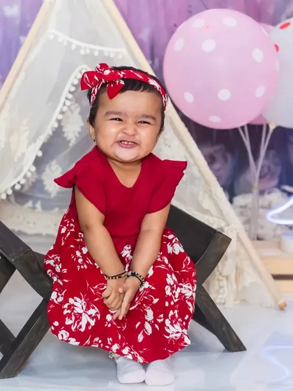 Capturing a funny "scrunched-nose" expression, this photo shows the playful side of a pre-birthday photoshoot.