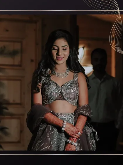 A moment of quiet elegance before the party. Her soft glam makeup and modern lehenga are a perfect combination for a chic Sangeet night.