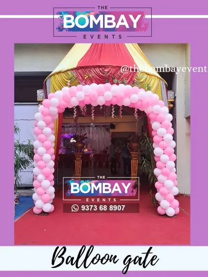 A simple and elegant pink and white balloon arch designed for a naming ceremony. This classic style is versatile and can be used for formal corporate announcements or office celebrations.
