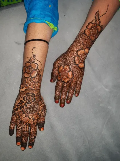 This shot highlights the contrast between the two different designs on each hand.