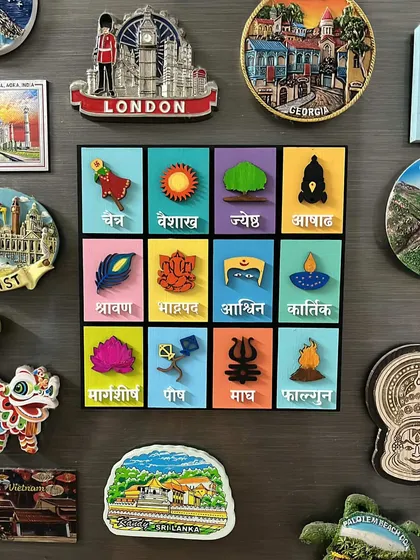 It's wonderful to see my Marathi month calendar enhancing the beauty of a client's home, displayed here among their collection of travel magnets.