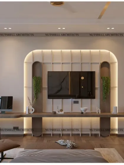 This bedroom features a beautifully crafted TV unit with a curved, upholstered backdrop. An extended floating desk provides a spacious and elegant workspace, seamlessly integrated into the room's design.