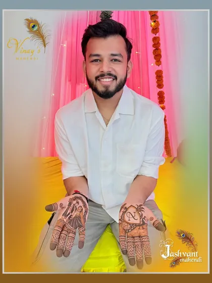 A complete view of the groom's mehndi, featuring a couple portrait and a custom initial design.