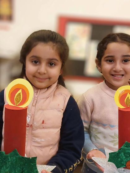 These two friends are delighted with the Christmas candles they made. Crafting together is a wonderful way to celebrate the holiday season.