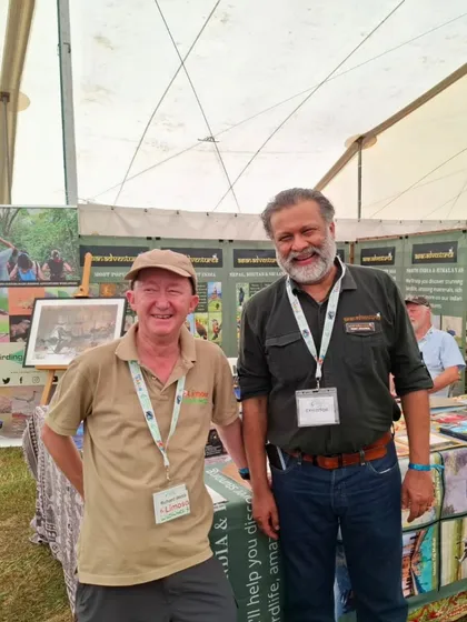 A happy moment shared between our team and a visitor at our Global Birdfair stall. These personal connections are the foundation of our community.