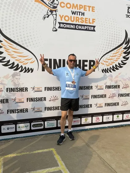 A member celebrating his finish with angel wings. We all feel like we can fly after a good race.
