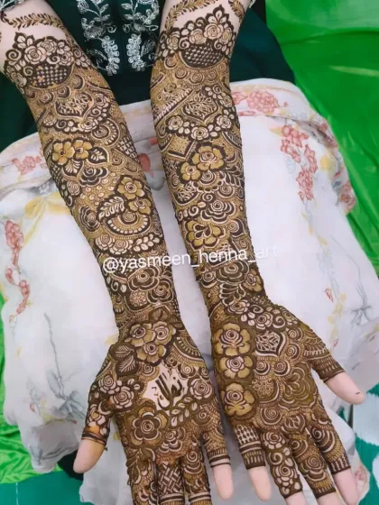 Alfiya's bridal mehndi, where her name is subtly woven into the intricate pattern on her palm.