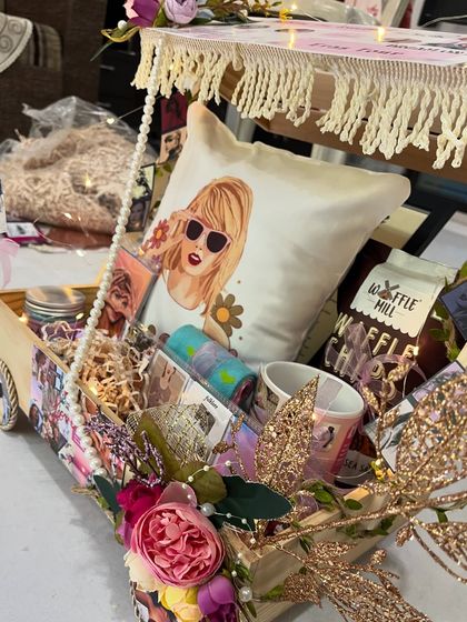 Another angle of the Taylor Swift inspired gift cart, showing how it's overflowing with custom goodies and thoughtful details.