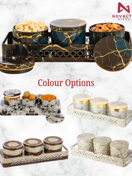 These festive dry fruit container sets are perfect for both gifting and serving. Available in multiple color options and designs, like this black and gold marble finish, they come with a matching tray.