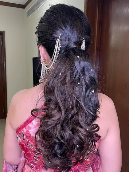 Another angle of the soft, curly ponytail with pearl details.