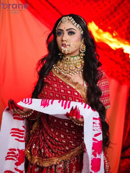 This powerful pose with the hand-printed cloth adds a storytelling element to the portfolio, a skill we encourage in our students.