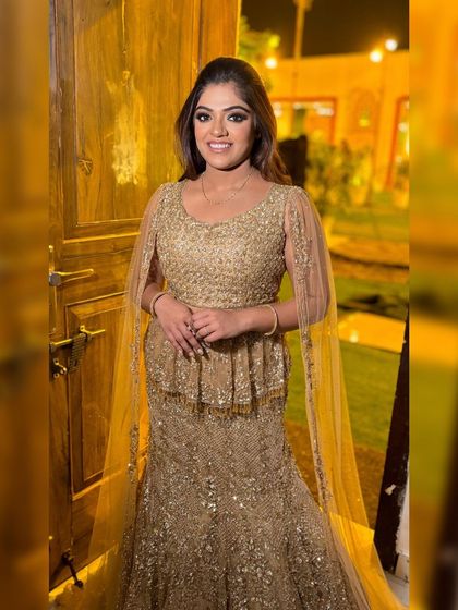 Saloni looking absolutely radiant in her golden Kalki Fashion outfit for her engagement. The makeup is warm and glowing.