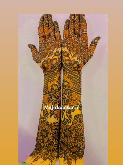 A complete view of a symmetrical bridal design, showing how the patterns match perfectly on both arms.