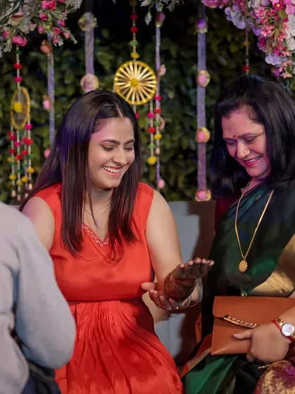 A sweet moment between the bride and a family member during the Mehandi ceremony.