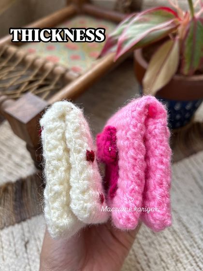 This photo shows the thickness of our crochet wallets, demonstrating how they are sturdy and well-padded to protect your cards.