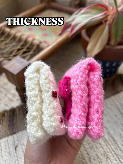 This photo shows the thickness of our crochet wallets, demonstrating how they are sturdy and well-padded to protect your cards.