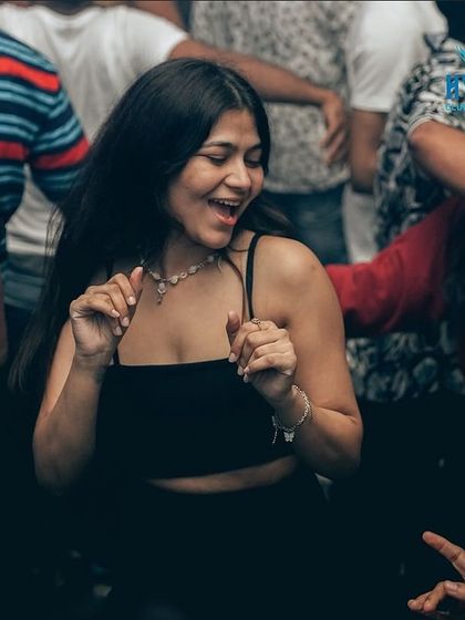 A candid moment of laughter and dancing at Hydra.