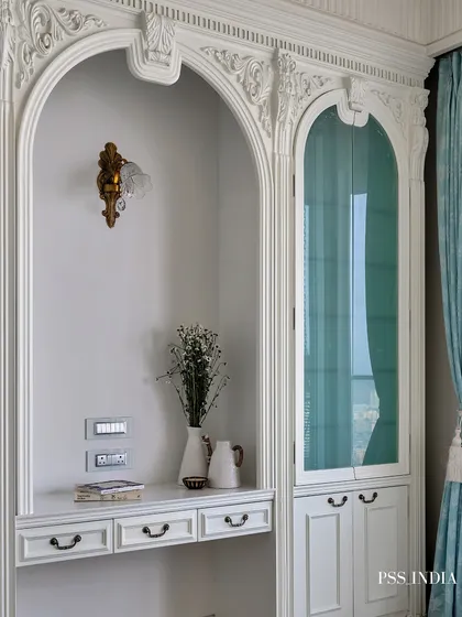 Softness in every corner, sophistication in every detail. This dreamy bedroom blends classic design, with its intricately carved moldings and pastel blue accents, with the calming energy of a modern sanctuary.