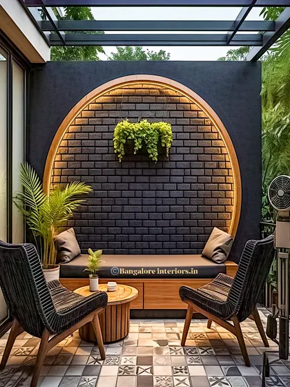 For a modern and sophisticated evening retreat, I focus on architectural elements and lighting. This design features a striking circular brick accent wall with integrated backlighting, creating a warm glow. The built-in seating and minimalist chairs make it a chic and intimate space for conversation.