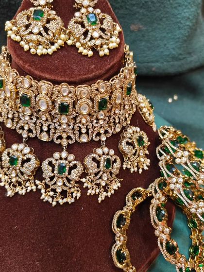 A beautiful Victorian choker and bangle set with green stones and pearl drops. This is a very elegant set for a reception or engagement.