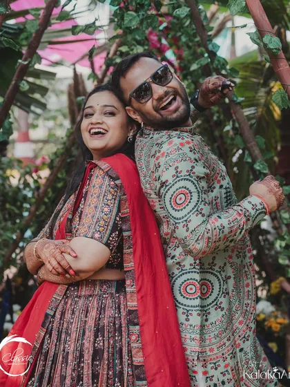 The joy of a Mehendi ceremony, perfectly framed by the rustic, leafy decor I designed. It's all about creating spaces where couples can be themselves and have fun.