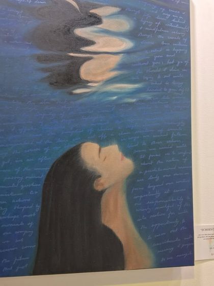 A contemplative piece by Sinal Bajaj showing a woman submerged in water with her thoughts written around her.