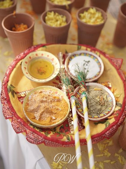 A close-up of the traditional elements used in a Haldi ceremony, beautifully arranged and ready for the rituals.