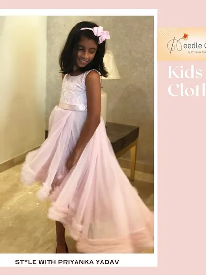 Here you can see the beautiful movement of the pink high-low gown. I design my dresses not just to look good standing still, but to create a wonderful visual effect when the child walks and twirls.