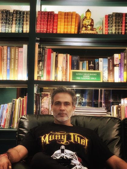 A moment of quiet reflection in a beautiful library during a work trip. Balancing a demanding career with moments of peace is essential for long-term success and well-being.