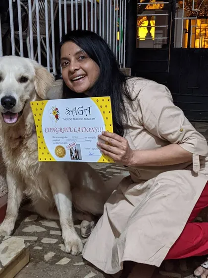 This is what it's all about. A happy dog and a proud pet parent celebrating their graduation from my training program. The certificate is just a piece of paper, but the confidence and bond they built are what truly matter.