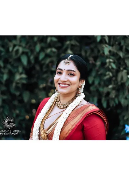 The pure joy of a bride on her wedding day. For Chinvatha, we went with a soft, natural makeup look that highlighted her beautiful smile and radiant skin, proving that sometimes the most stunning look is one that feels completely real and effortless.