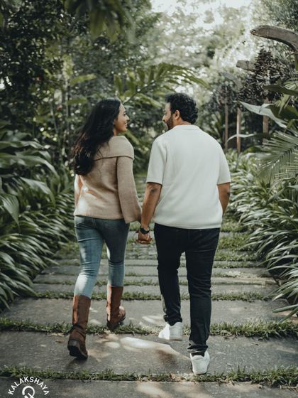 Walking into the future together. A simple yet powerful shot from behind, symbolizing the journey the couple is about to embark on.