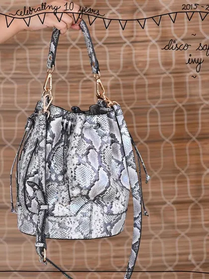 The Ivy bucket bag in our new Disco Safari leather. This print features a mix of grey and silver tones with a metallic foil finish, creating a versatile piece that works for both day and night.