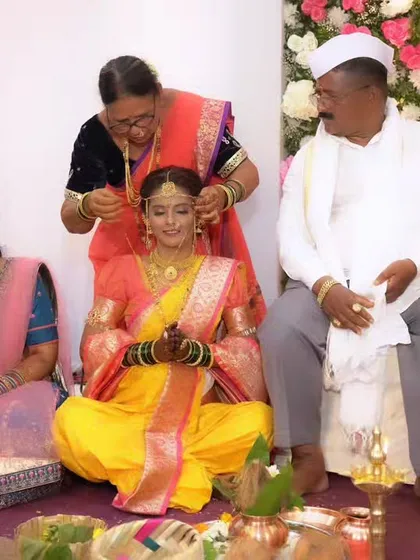 Family members participating in the wedding rituals, with the bride as the radiant centerpiece.