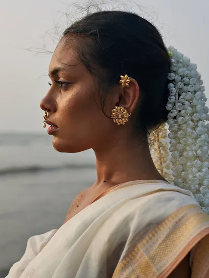 An editorial concept shoot at the beach, where the setting sun and the sea become part of the narrative. This image blends traditional Indian elements like the saree and gajra with an artistic, contemporary vision. It’s an example of how I creatively direct shoots to push beyond the conventional.