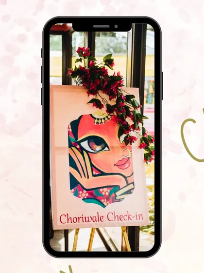 We add fun, personal touches to every event. This hand-painted "Choriwale Check-in" sign for the bride's side set a playful tone right from the start, sparking some friendly rivalry and excitement among the guests.