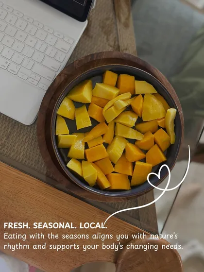Fresh, seasonal, and local. Eating with the seasons, like enjoying this bowl of fresh mangoes, aligns us with nature's rhythm and supports our body's needs.