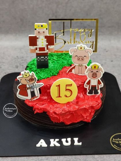 A cake for a Technoblade fan, featuring the iconic pig king character. The design uses red and green frosting to represent the Minecraft world.